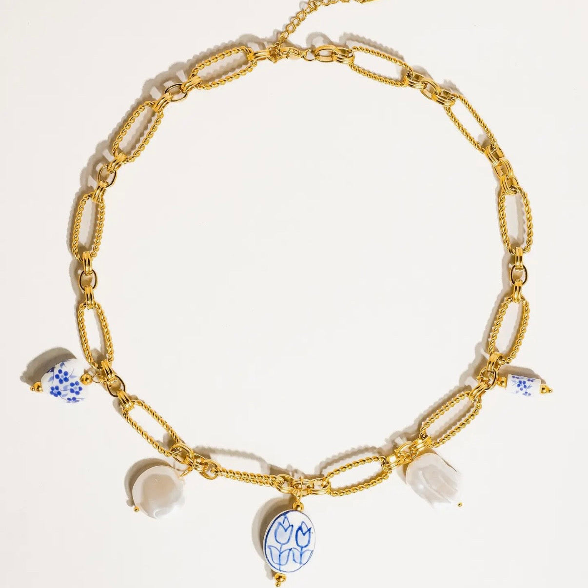 Blue and pearl charm necklace