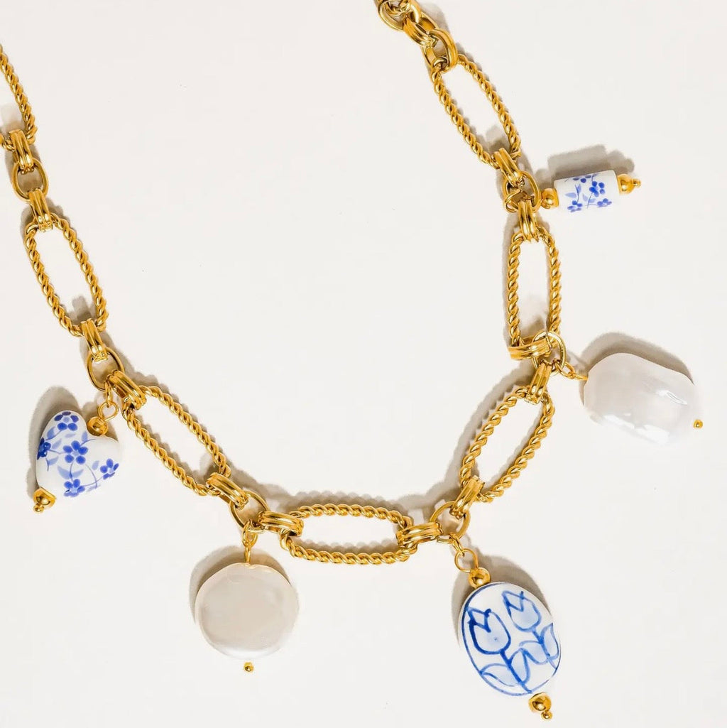 Blue and pearl charm necklace