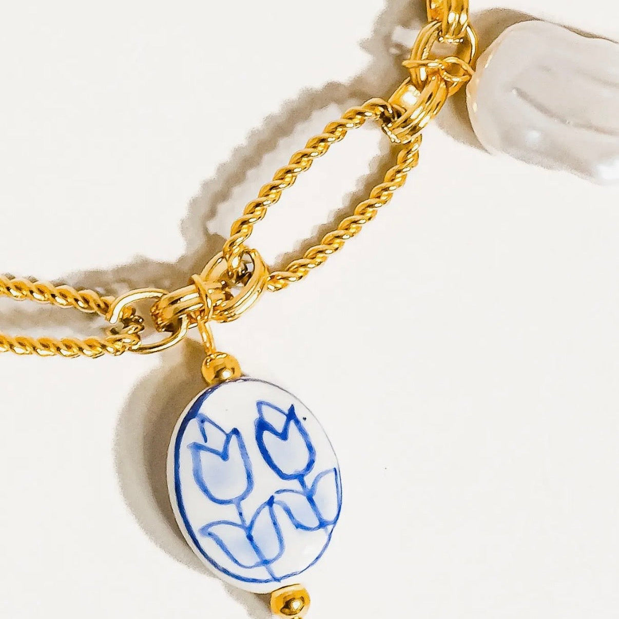 Blue and pearl charm necklace